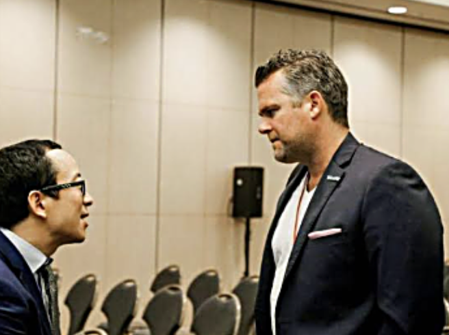 William Skelley in conversation at an event